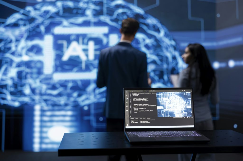 Focus on laptop running AI cognitive computing tech used by IT staff members